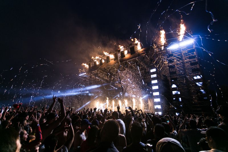 Music festival crowd and stage lights